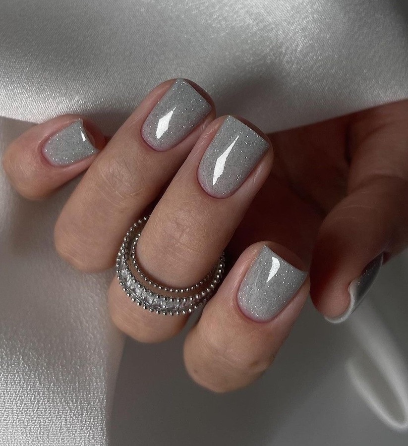 Light grey nails with sparkles