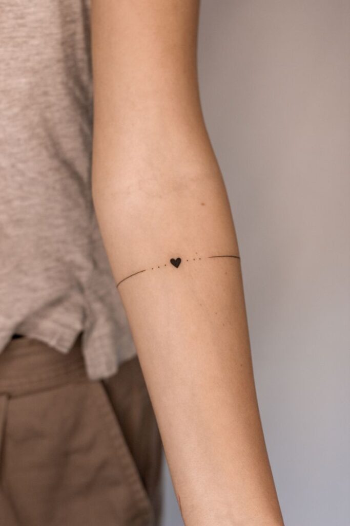 minimalist arm band tattoo