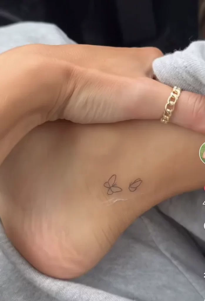 One line art butterfly tattoo on ankle
